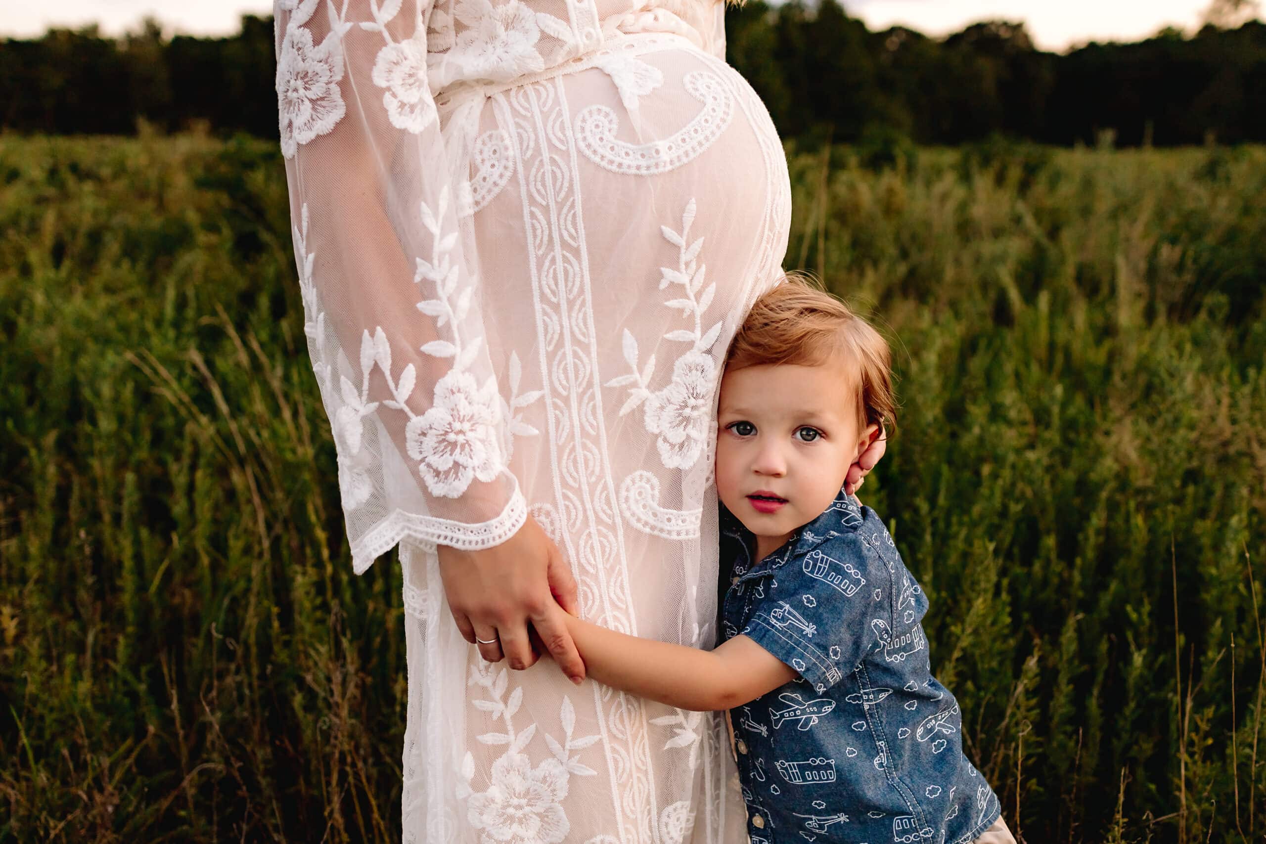 Mom holding toddler boy's hand in a